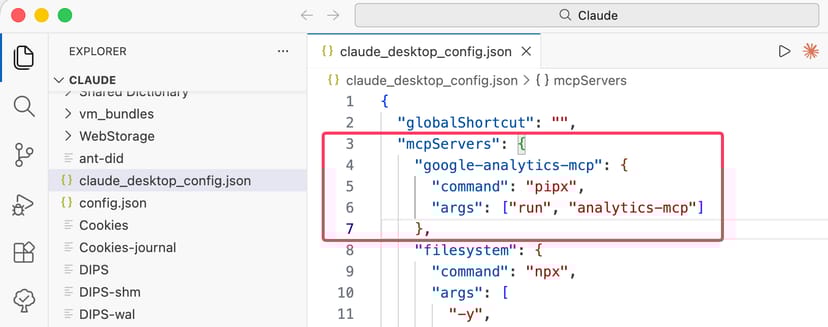 VS Codeでclaude_desktop_config.jsonを編集している画面。google-analytics-mcpの設定が赤枠で囲まれている
